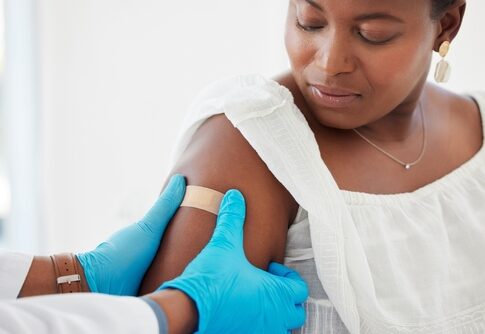 A healthcare professional administering a vaccine to a patient